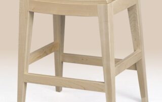 Designer Stool in maple wood with lacquer finish, showcasing natural imperfections for modern and city living. American made.