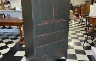 Historical Shaker Clothes Cabinet with flat panel doors, wooden drawer pulls, and rat tail hinges, available in tiger maple, cherry, or painted finishes.