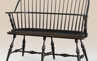 Historical Mashpee Windsor Settee in historical black over natural finish, classic design with quality construction.