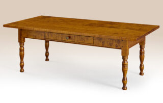 Historical Clarksville Coffee Table with Sheraton legs in tiger maple finish.