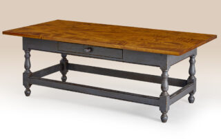 Historical Richmond Stretcher Base Coffee Table with dovetailed drawer and stretcher base, shown in tiger maple wood with Williamsburg blue over natural base.