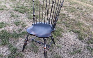 Historical Nine Spindle Fan Back Windsor Side Chair with brace back in black over natural finish, perfect for dining or kitchen, American made.