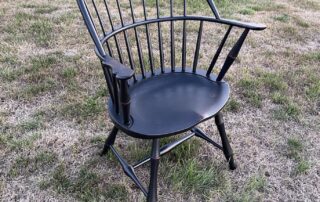 Historical Connecticut Sack Chair with antique black over red crackle finish, suitable for dining or accent use, American made.