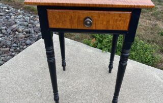 Historical Salem Stand with Tiger Maple Top, dovetailed drawer, and Antique Black over Red Crackle Frame. Perfect for living spaces.