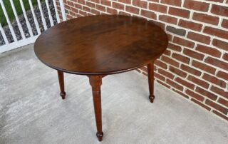 Round Cherry Wood Country Splay Leg Table, American-made, available in cherry or with an antique black over red painted base.