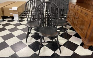 Set of 9 Historical Bow Back Windsor Side Chairs in black over red crackle finish, sculpted design, perfect for dining or kitchen table, American made.