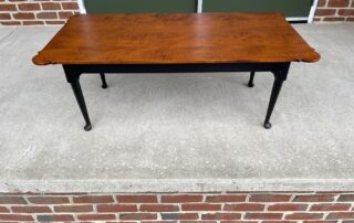 Porringer Coffee Table with tiger maple top, antique black over red base, porringer ends, and Queen Anne legs, American made.