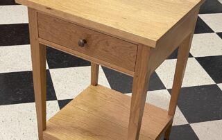 Cherry Wood Shaker Stand with natural finish, walnut drawer pull, and dovetailed drawer. Perfect for living or family rooms.