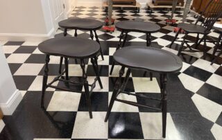 Set of 4 Windsor Stools with Antique Black over Red Painted Finish, 25in seat height for 36in counter height.