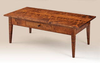 Enfield Shaker Coffee Table in tiger maple wood with walnut drawer pull.