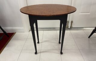 Oval Queen Anne Tea Table with Tiger Maple Top and Antique Black over Red Base. Ideal for family or living rooms. American made.