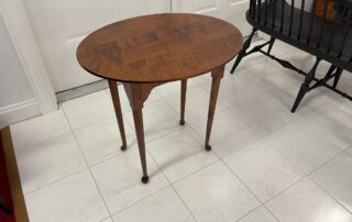 Oval Queen Anne Tea Table crafted from tiger maple wood, perfect for family or living rooms, American made.