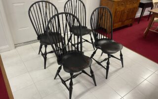 Set of 4 Historical Bow Back Side Windsor Chairs with Brace, finished in Antique Black over Red Crackle, perfect for dining or kitchen, American made.