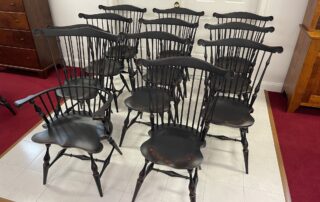 Set of 11 Fan Back Windsor Chairs in Antique Black over Red Crackle Finish, American made.