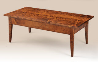 Pleasant Hill Shaker Coffee Table with taper legs, shown in tiger maple wood.