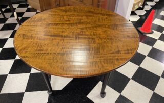 48in Round Queen Anne Farmhouse Table with Light Hand Planed Tiger Maple Top and Antique Black over Red Queen Anne Leg Base, American-made.