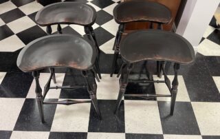 Set of 4 Windsor style Saddle Seat kitchen stools in antique black over red crackle finish, American-made