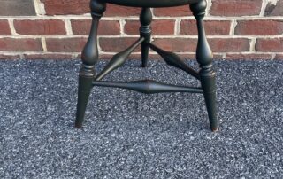 Historical Farm Table Stool with Windsor Style and Black Green over Red Finish, crafted in the USA with turned legs