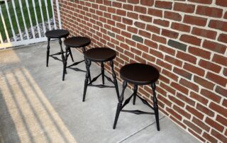 Set of 4 Historical Pennsylvania Windsor Style Stools in Antique Black over Red Crackle Painted Finish