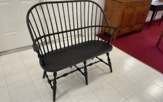 Painted Farmhouse Bench with Windsor Style, Antique Black over Red Finish, turned legs, crafted in Pennsylvania