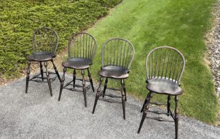 Set of 4 Low Bow Back Windsor Stools with Antique Black over Red Crackle Finish, featuring Windsor style design and shaped seats.