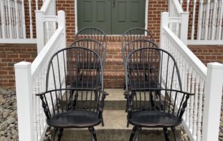 Set of 6 Windsor Chairs with 2 Sack Back Armchairs and 4 Bow Back Side Chairs in Antique Black over Red Crackle Finish, American made.