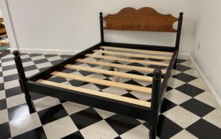 American Made Queen Size Cannonball Bed with shaped tiger maple headboard and antique black over red crackle frame, crafted in the USA.