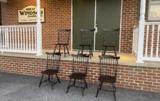 Set of six Fan Back Side Windsor Chairs with turned legs and shaped seats, finished in antique black over red. Crafted in Pennsylvania.