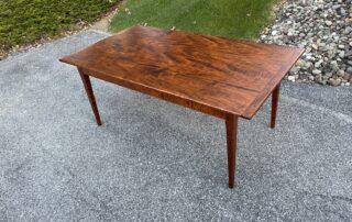 6ft Tiger Maple Farm Table with breadboard ends, tapered legs, and light planed top, handcrafted in Pennsylvania.