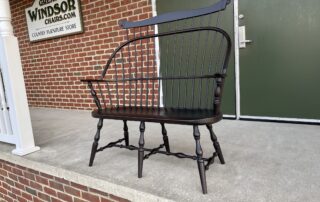 American Made Painted Windsor Bench with bold comb and antique black over red finish, crafted in Pennsylvania.