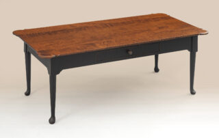 Colonial Coffee Table with Drawer in tiger maple wood with antique black over red crackle base.