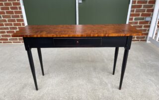 New Shaker Sofa Table with tiger maple top, dovetailed drawer, and antique black over red crackle base, crafted in the USA.