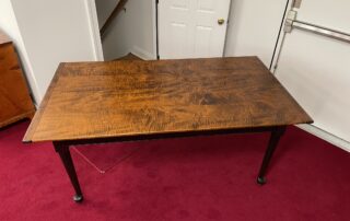 6ft Queen Anne Farm Table with tiger maple top, antique black over red base, and Queen Anne style legs, handcrafted in Pennsylvania.