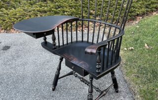 Philadelphia Writing Armchair in Antique Black over Red Crackle Finish with carved knuckles, ears, and two drawers. American made.