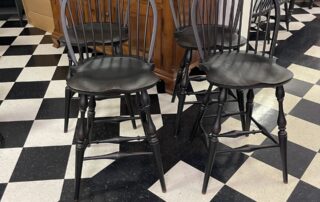A set of 4 Non Swivel Historical Low Bow Back Windsor Stools, crafted in the USA.
