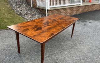 A handcrafted 7ft x 38 1/2in Kitchen Table with two 15in Company Board Extensions, made from exquisite Tiger Maple Wood.