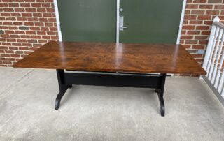 7ft Trestle Table with a Tiger Maple hand-planed top and Antique Black over Red trestle base, ideal for dining rooms or large kitchens.