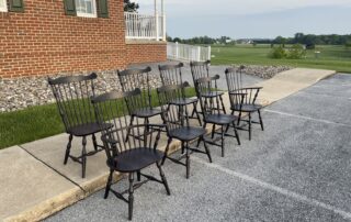 A set of 8 New England Fan Back Windsor chairs, including 2 armchairs and 6 side chairs, crafted in Pennsylvania.