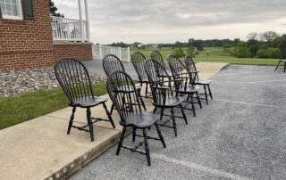 A collection of 8 Windsor chairs, including 2 Sack Back Armchairs and 6 Bow Back Side Chairs, crafted in Pennsylvania.