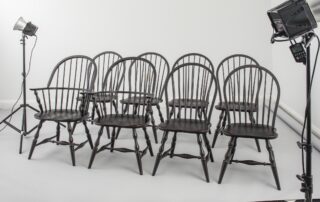 Set of 8 Black Jefferson Windsor Chairs with turned legs, antique black over red finish, and classic Windsor design for timeless elegance.