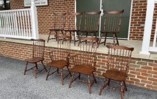 n exquisite set of 8 Cherry Wood Windsor chairs, including 2 Cherry Fan Back Windsor Armchairs and 6 Cherry Fan Back Windsor Side Chairs, crafted in Pennsylvania.