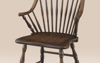 Concord Windsor Armchair in maple finish with continuous arm and turned legs.