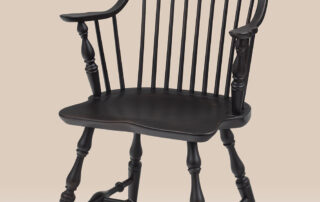 Continuous Arm Windsor Chair with seamless arm design, shaped seat, and turned legs. Ideal for country kitchens or dining rooms.