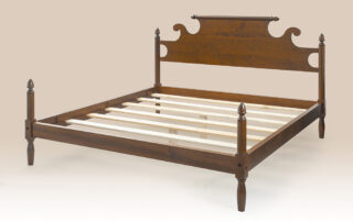 Farmhouse Acorn Bed in cherry wood, showcasing a rolling pin headboard and acorn motifs, blending antique style with modern comfort.