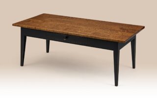 Historical Quarryville Coffee Table with tapered legs and a dovetailed drawer, shown with tiger maple top and painted base.