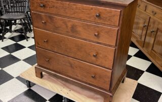 Shaker Style Chest of Drawers made of Cherry Wood with dovetailed drawers and bracket feet, ideal for Shaker or modern settings.