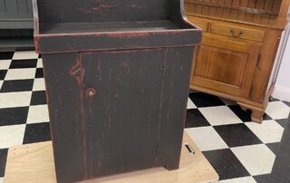 Vermont Dry Sink with rustic black over red finish, ideal for country or antique settings in kitchens, dining rooms, or foyers.