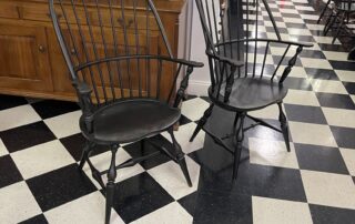 A pair of historical sack back Windsor armchairs, crafted in the USA with exceptional craftsmanship and attention to detail.