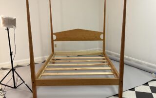 A Cherry Queen Size Pencil Post Bed, featuring a natural lacquer protective coat that highlights the beautiful graining of the cherry wood.
