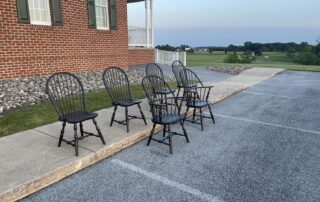 A set of 6 Windsor chairs, including 2 Sack Back Armchairs and 4 Bow Back Side Chairs, crafted in Pennsylvania.